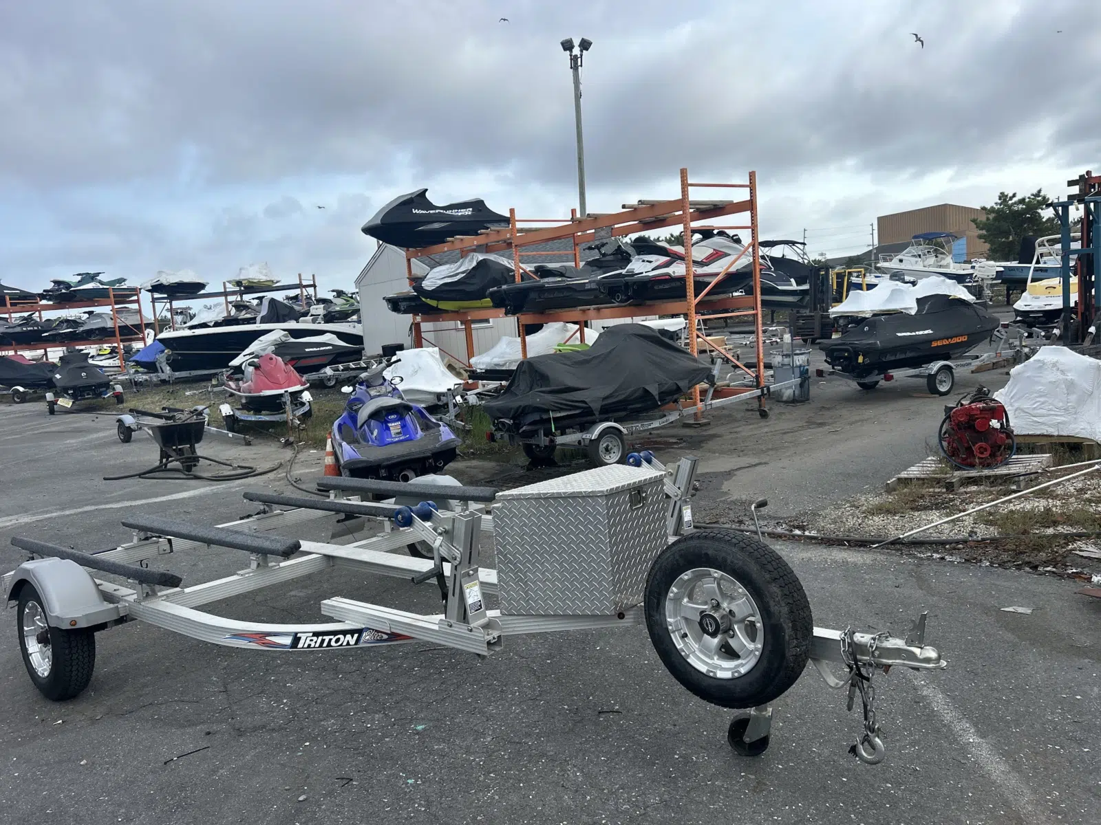 Aluminum Triton jet ski trailer in a storage yard — JetPro Powersport in Atlantic City