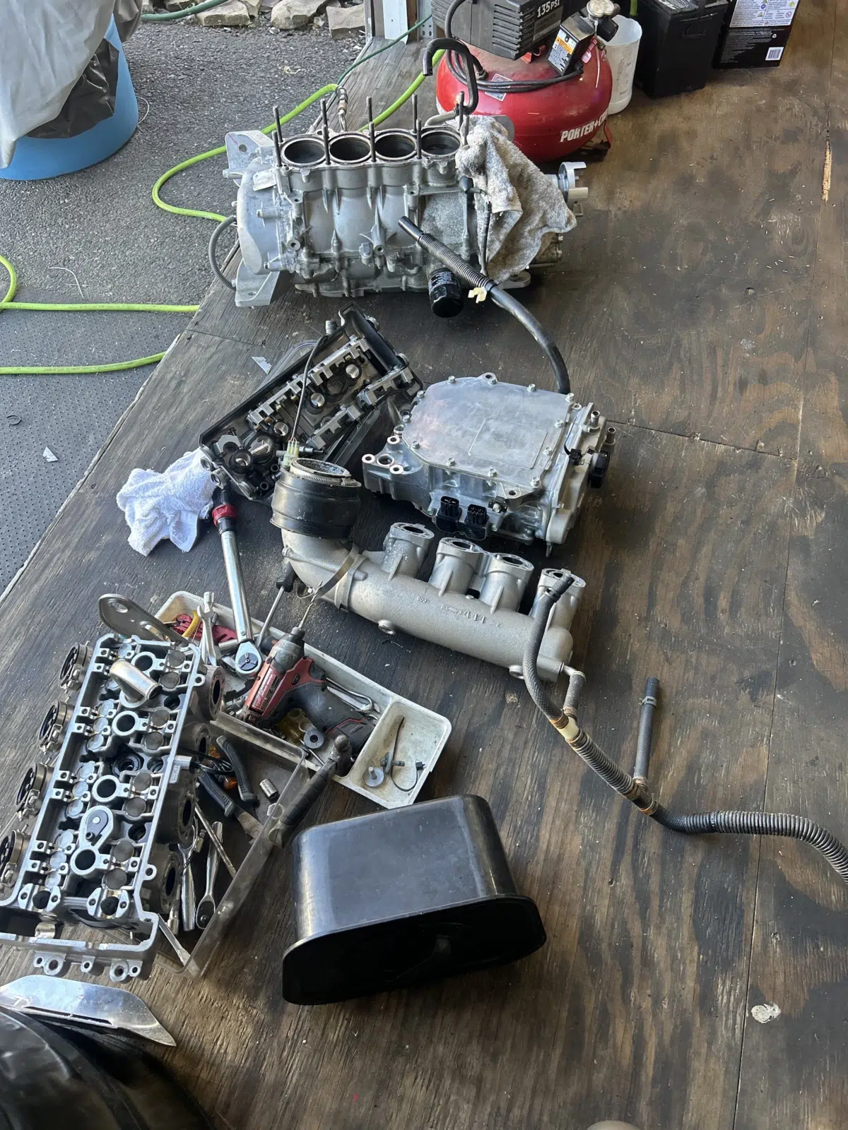 Disassembled engine parts laid out on a workshop bench — JetPro Powersport in Atlantic City