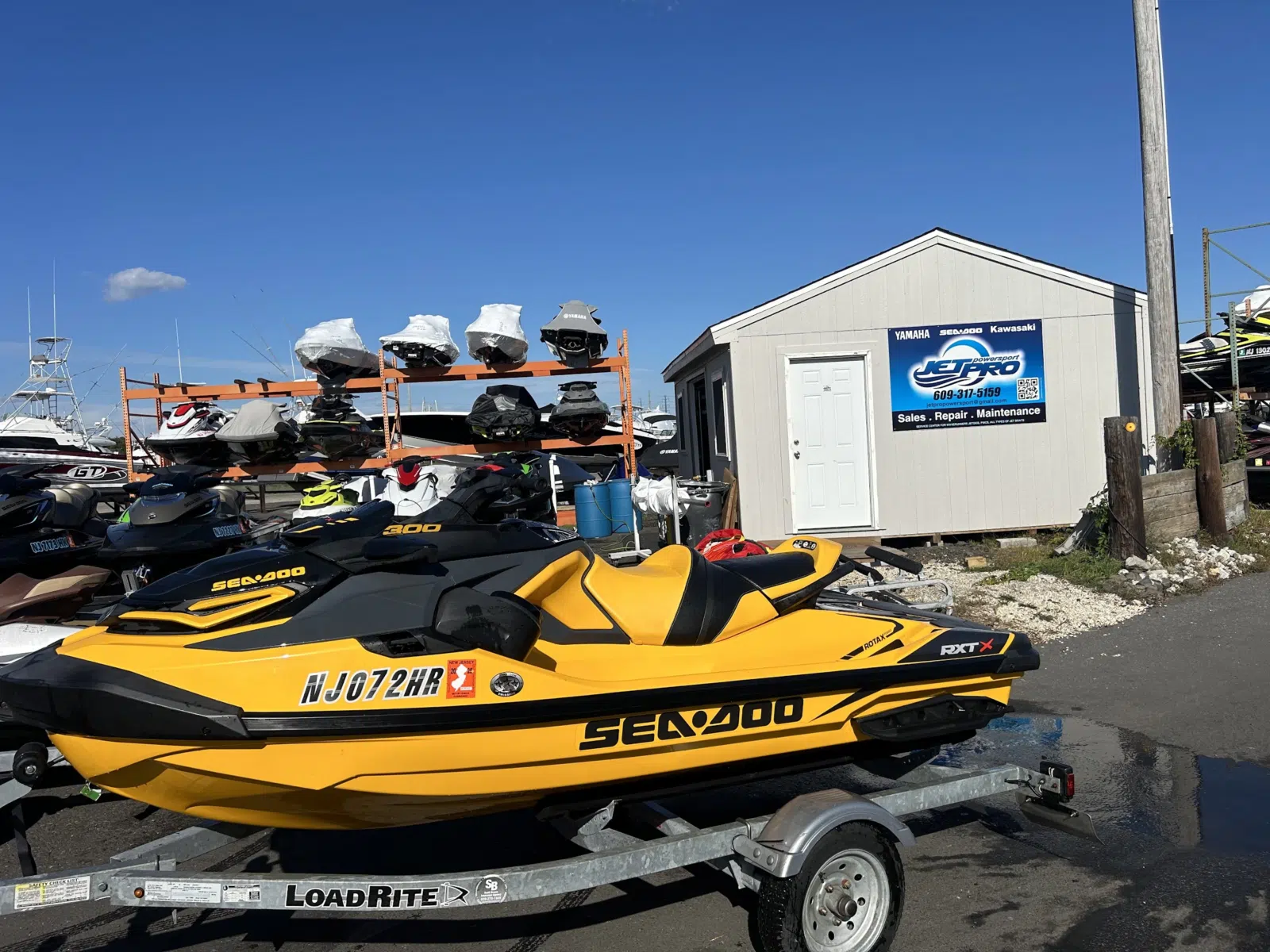 Yellow Sea-Doo jet ski on a trailer outside the shop — JetPro Powersport in Atlantic City